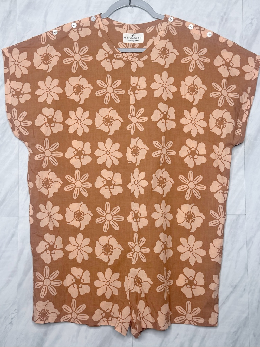 WAIWAIOLANI Floral Short-Sleeve Romper in Rust and Pale Peach